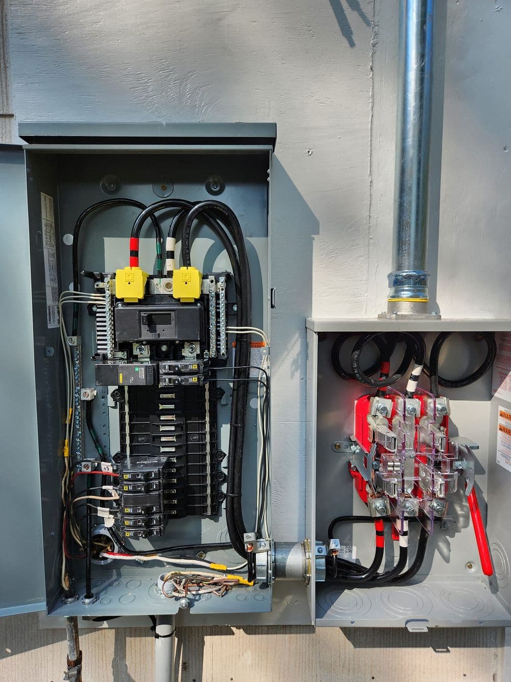 Electrical panel with circuit breakers and wiring connections in a residential setting.